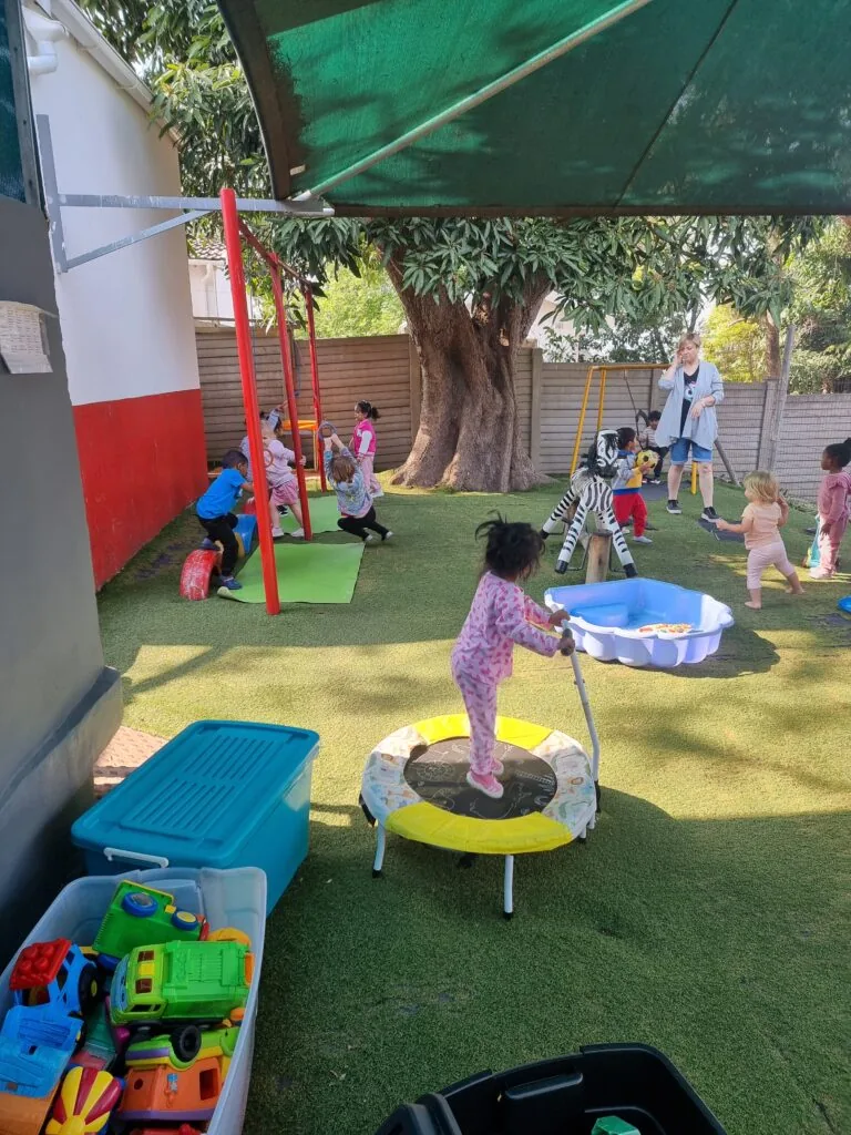 Toddler class children playing in a bright classroom at Scamps preschool Queensburgh